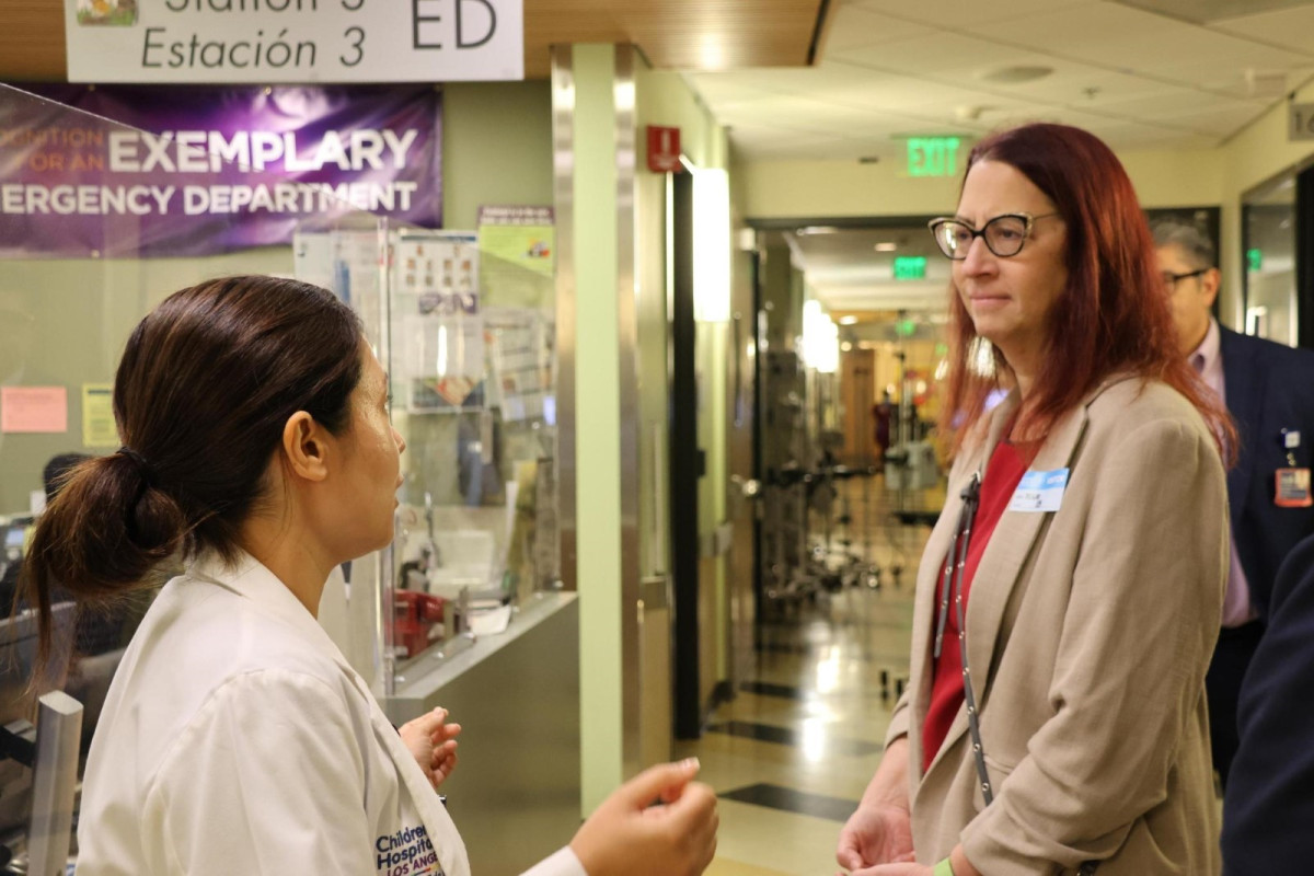 Above: Friedman speaks to a doctor at Children’s Hospital Los Angeles.