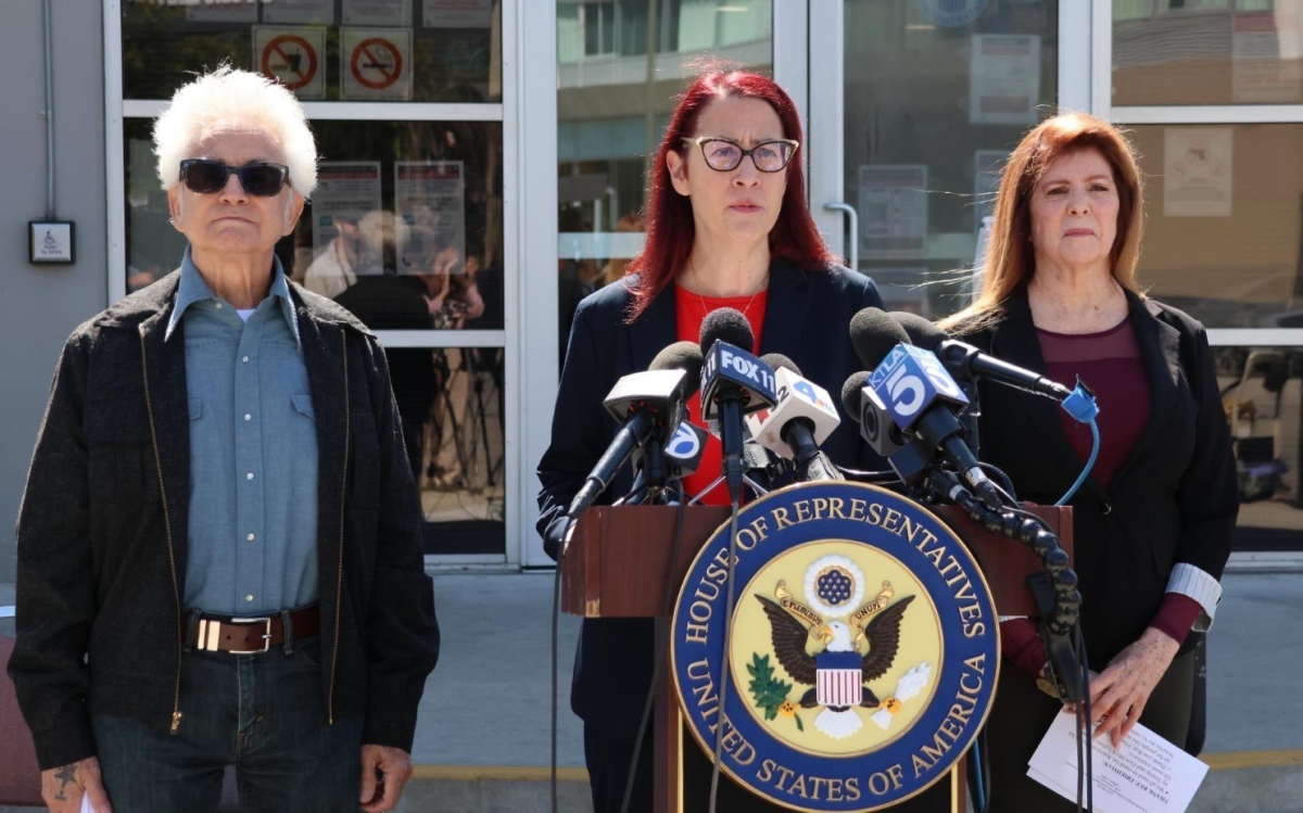 Above: Friedman stands with local seniors and veterans.
