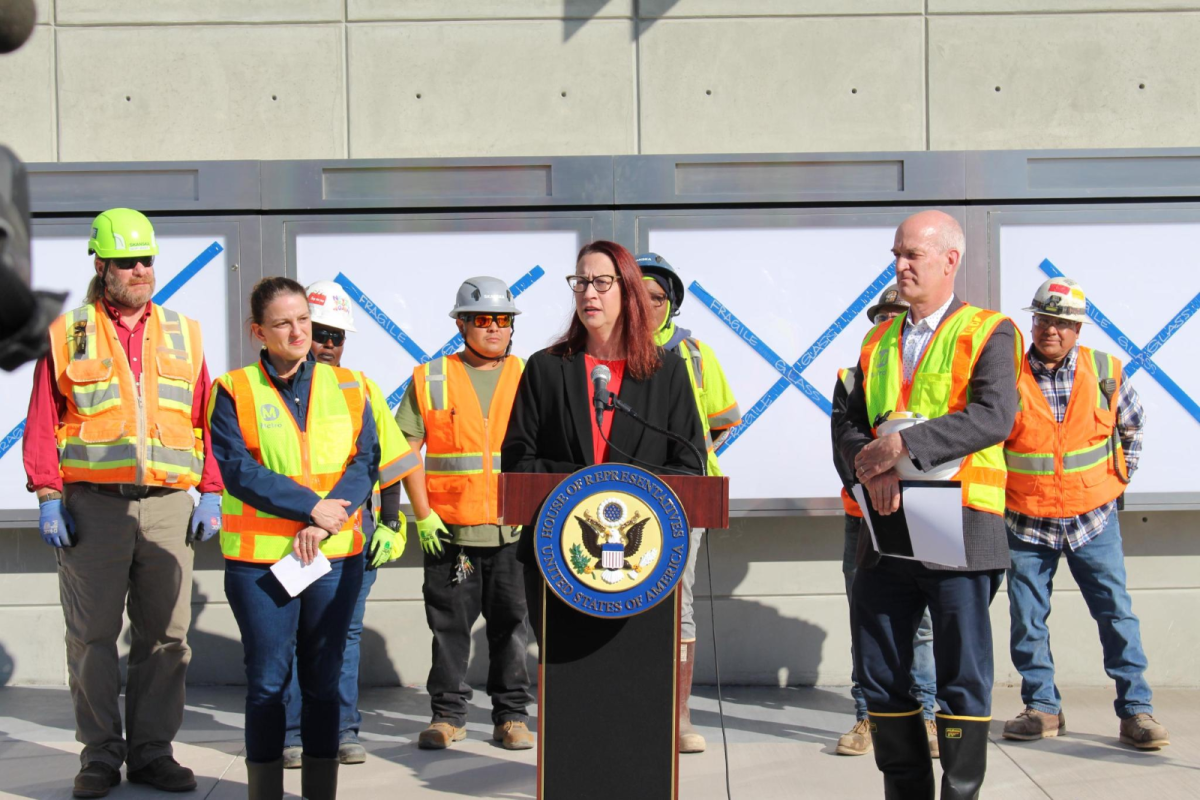 Laura at a podium