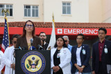 Above: Friedman standing with frontline healthcare workers and patients.