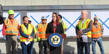 Laura at a podium