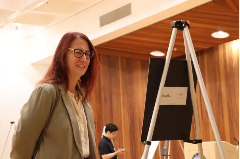 Below: Friedman looks at student artwork.